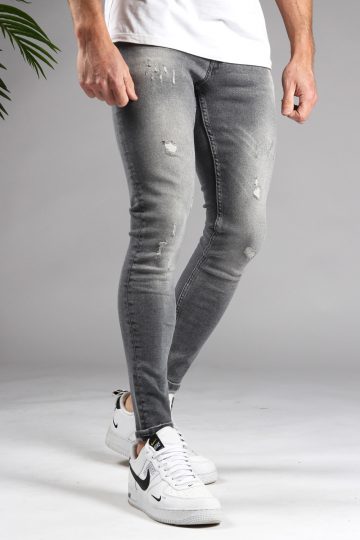 Vooraanzicht lichtgrijze denim skinny jeans voor heren met damaged afwerking.
