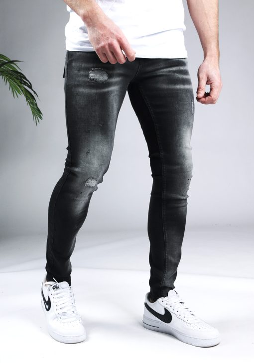 Rechter zijaanzicht Malelions zwarte heren skinny jeans met damaged uitstraling.