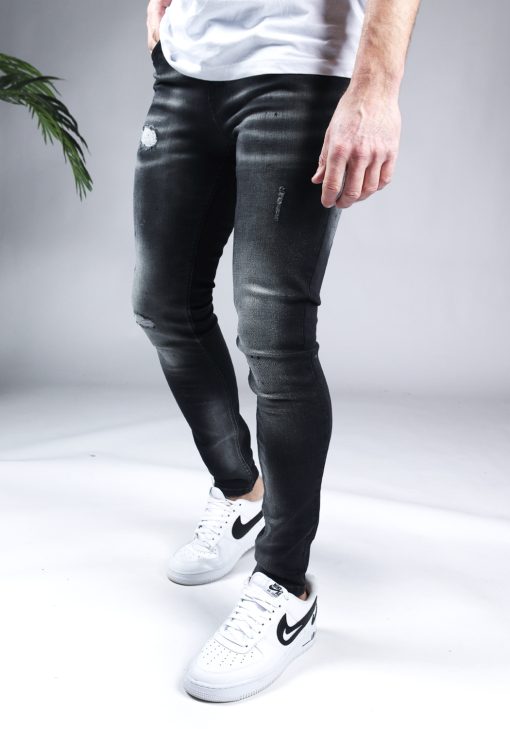 Linker zijaanzicht Malelions zwarte heren skinny jeans met damaged uitstraling.
