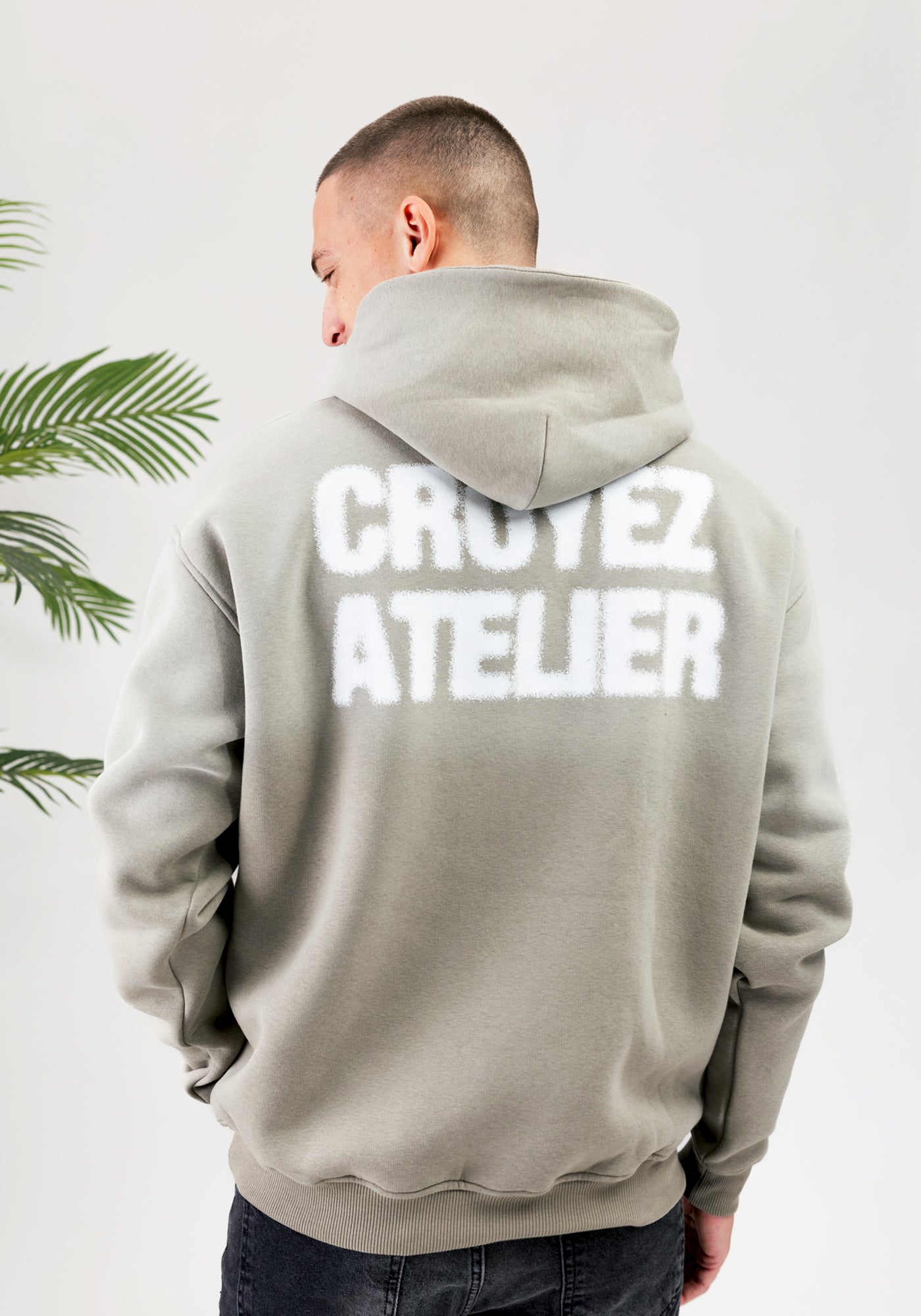 https://cdn.shopify.com/s/files/1/0935/6315/8909/files/CROYEZ_SPRAYED_ATELIER_HOODIE--CD1083-DUSTY_OLIVE-3.jpg?v=1771517401 Cotton District CROYEZ SPRAYED ATELIER HOODIE DUSTY OLIVE