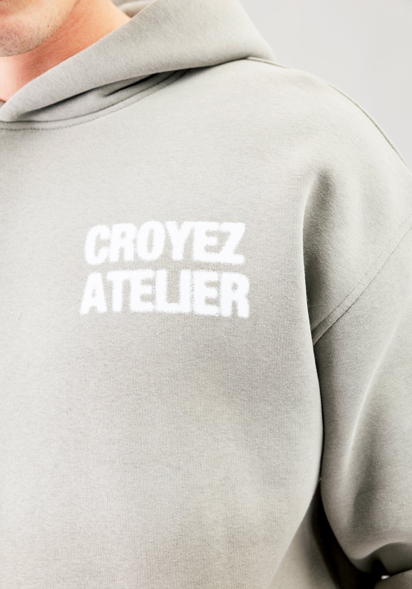 https://cdn.shopify.com/s/files/1/0935/6315/8909/files/CROYEZ_SPRAYED_ATELIER_HOODIE--CD1083-DUSTY_OLIVE-5.jpg?v=1771517402 Cotton District CROYEZ SPRAYED ATELIER HOODIE DUSTY OLIVE