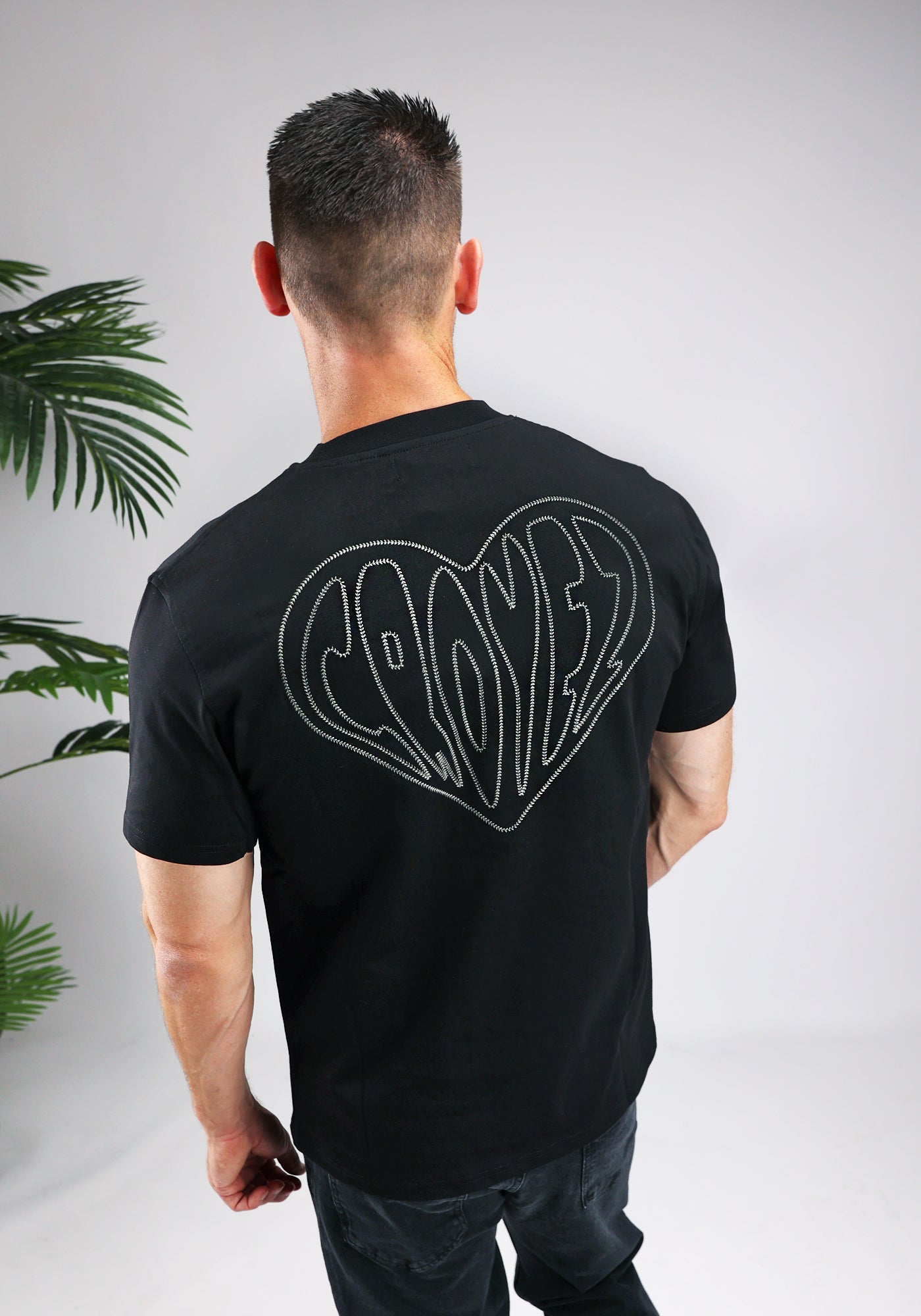 https://cdn.shopify.com/s/files/1/0935/6315/8909/files/CROYEZ_STITCHED_HEART_T-SHIRT--CD1044-BLACK-2.jpg?v=1771495291 Cotton District CROYEZ STITCHED HEART T-SHIRT BLACK