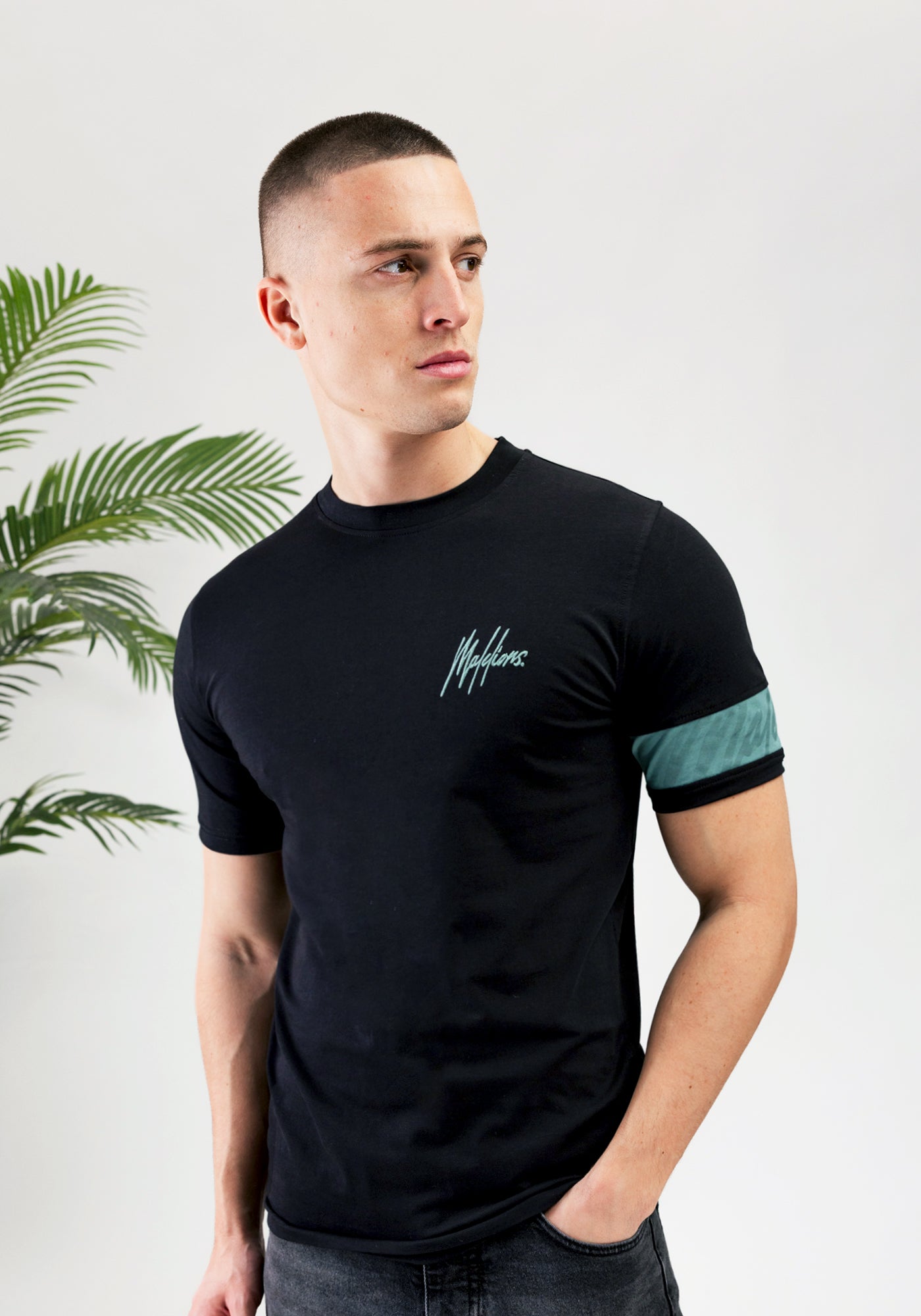 https://cdn.shopify.com/s/files/1/0935/6315/8909/files/MALELIONS_CAPTAIN_T-SHIRT--CD1059-BLACK.jpg?v=1771500698 Cotton District MALELIONS CAPTAIN T-SHIRT BLACK