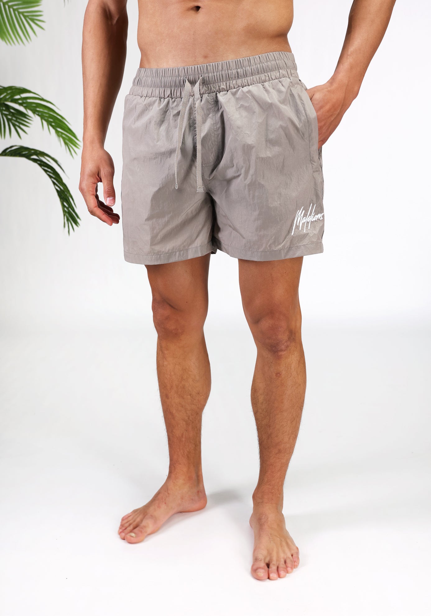 https://cdn.shopify.com/s/files/1/0935/6315/8909/files/MALELIONS_CRINKLE_SWIMSHORTS--CD1121-TAUPE-3.jpg?v=1772105460 Cotton District MALELIONS CRINKLE SWIMSHORTS TAUPE