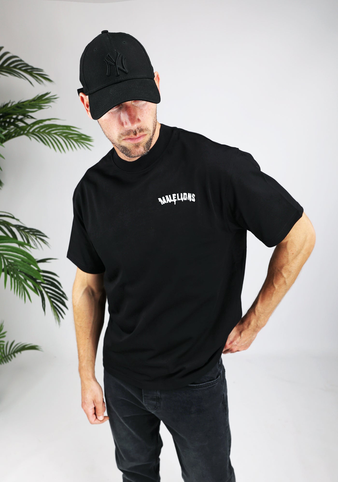 https://cdn.shopify.com/s/files/1/0935/6315/8909/files/MALELIONS_GRAFFITY_T-SHIRT--CD1050-BLACK-1.jpg?v=1771496360 Cotton District MALELIONS GRAFFITY T-SHIRT BLACK