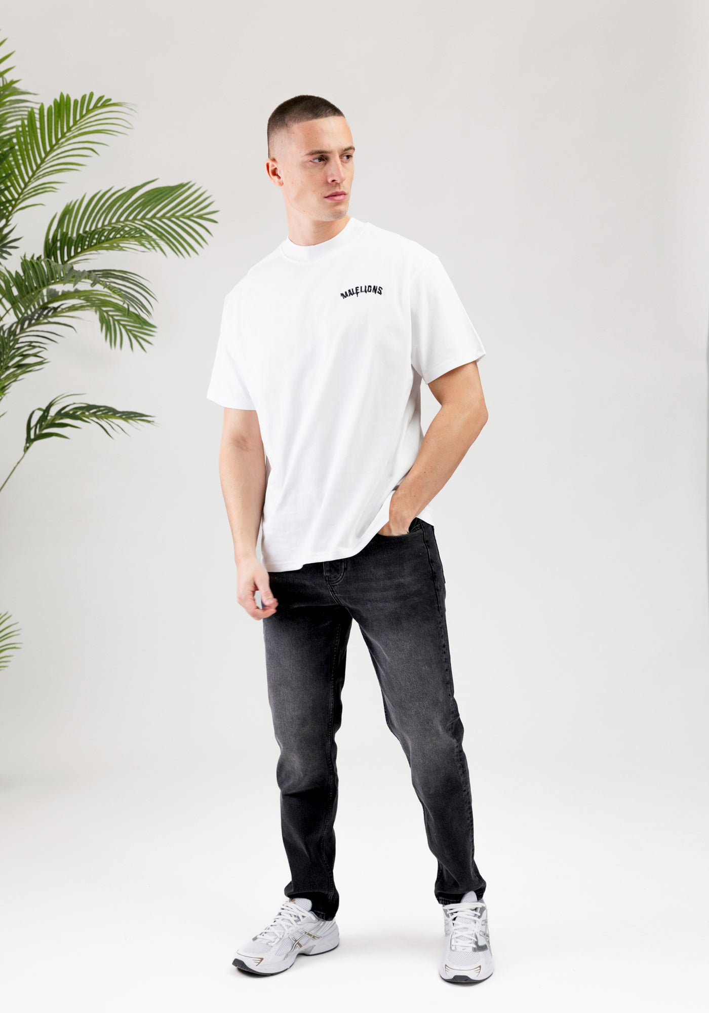 https://cdn.shopify.com/s/files/1/0935/6315/8909/files/MALELIONS_GRAFFITY_T-SHIRT--CD1050-WHITE-2.jpg?v=1771496377 Cotton District MALELIONS GRAFFITY T-SHIRT WHITE
