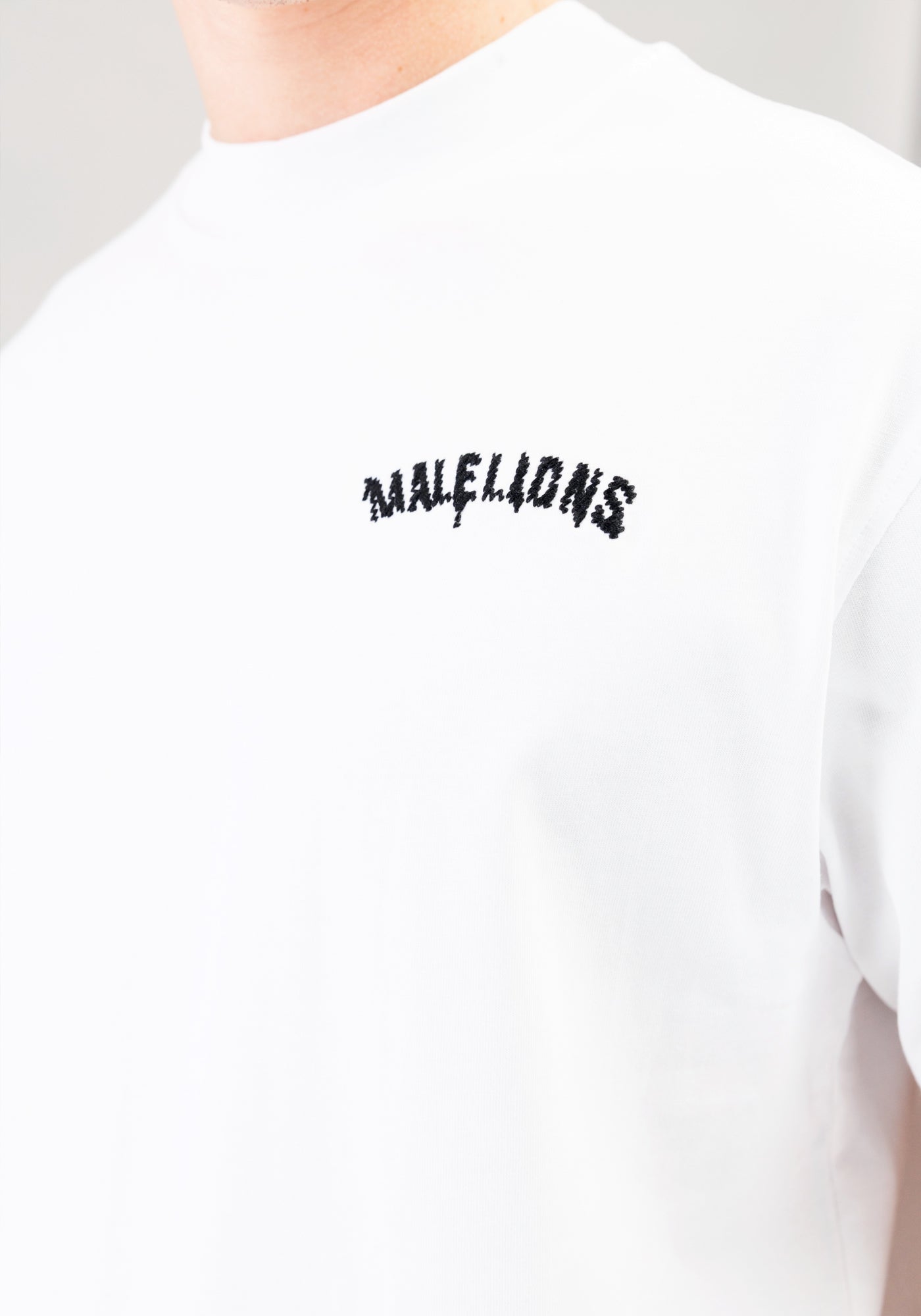 https://cdn.shopify.com/s/files/1/0935/6315/8909/files/MALELIONS_GRAFFITY_T-SHIRT--CD1050-WHITE-3.jpg?v=1771496377 Cotton District MALELIONS GRAFFITY T-SHIRT WHITE
