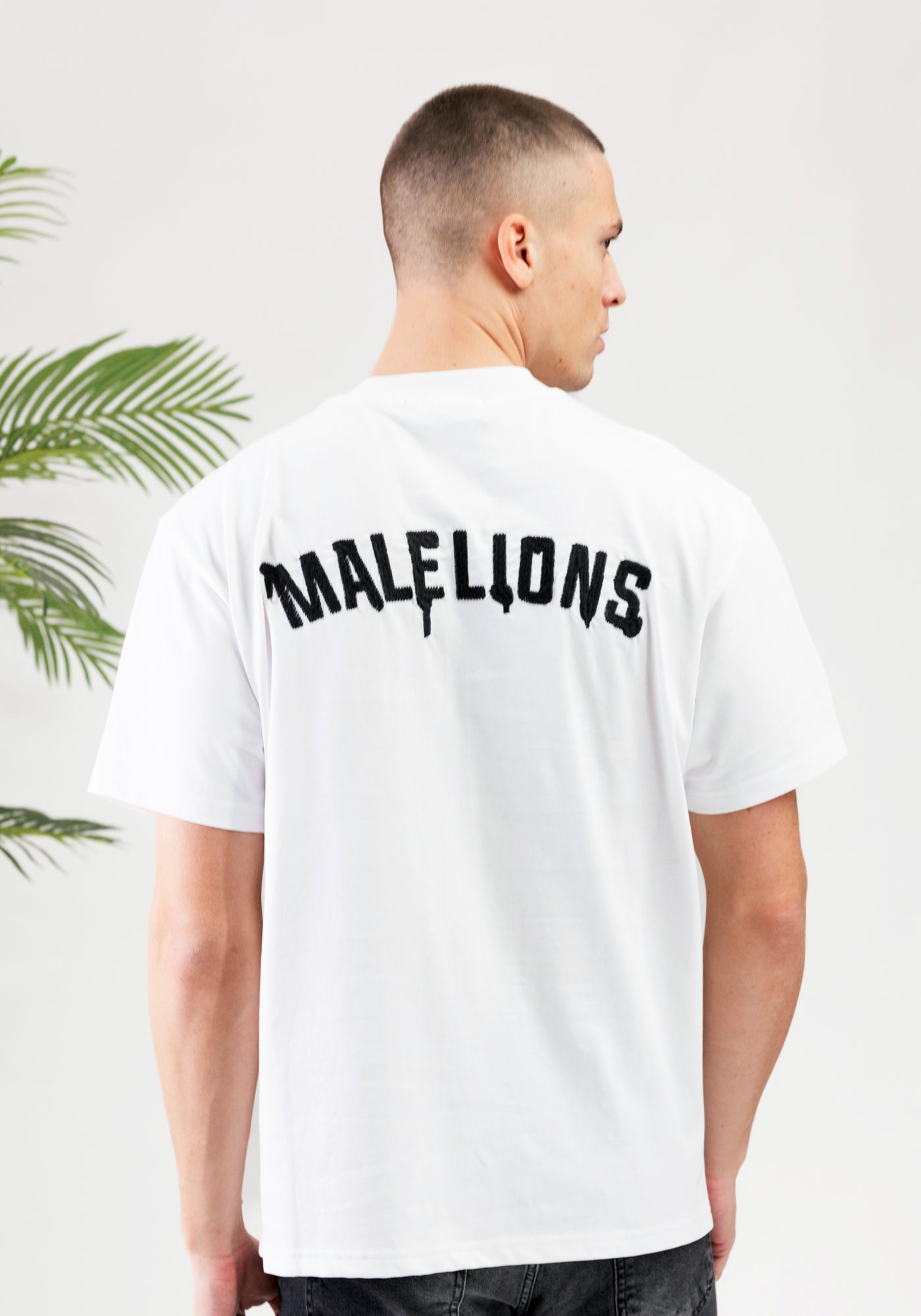 https://cdn.shopify.com/s/files/1/0935/6315/8909/files/MALELIONS_GRAFFITY_T-SHIRT--CD1050-WHITE.jpg?v=1771496377 Cotton District MALELIONS GRAFFITY T-SHIRT WHITE