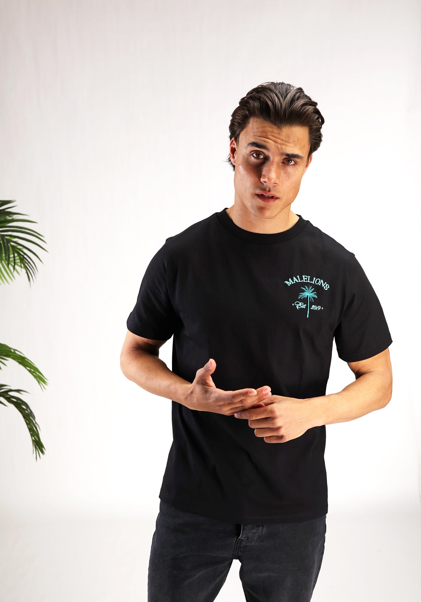 https://cdn.shopify.com/s/files/1/0935/6315/8909/files/MALELIONS_JUNGLE_T-SHIRT--CD1060-BLACK-1.jpg?v=1771503521 Cotton District MALELIONS JUNGLE T-SHIRT BLACK