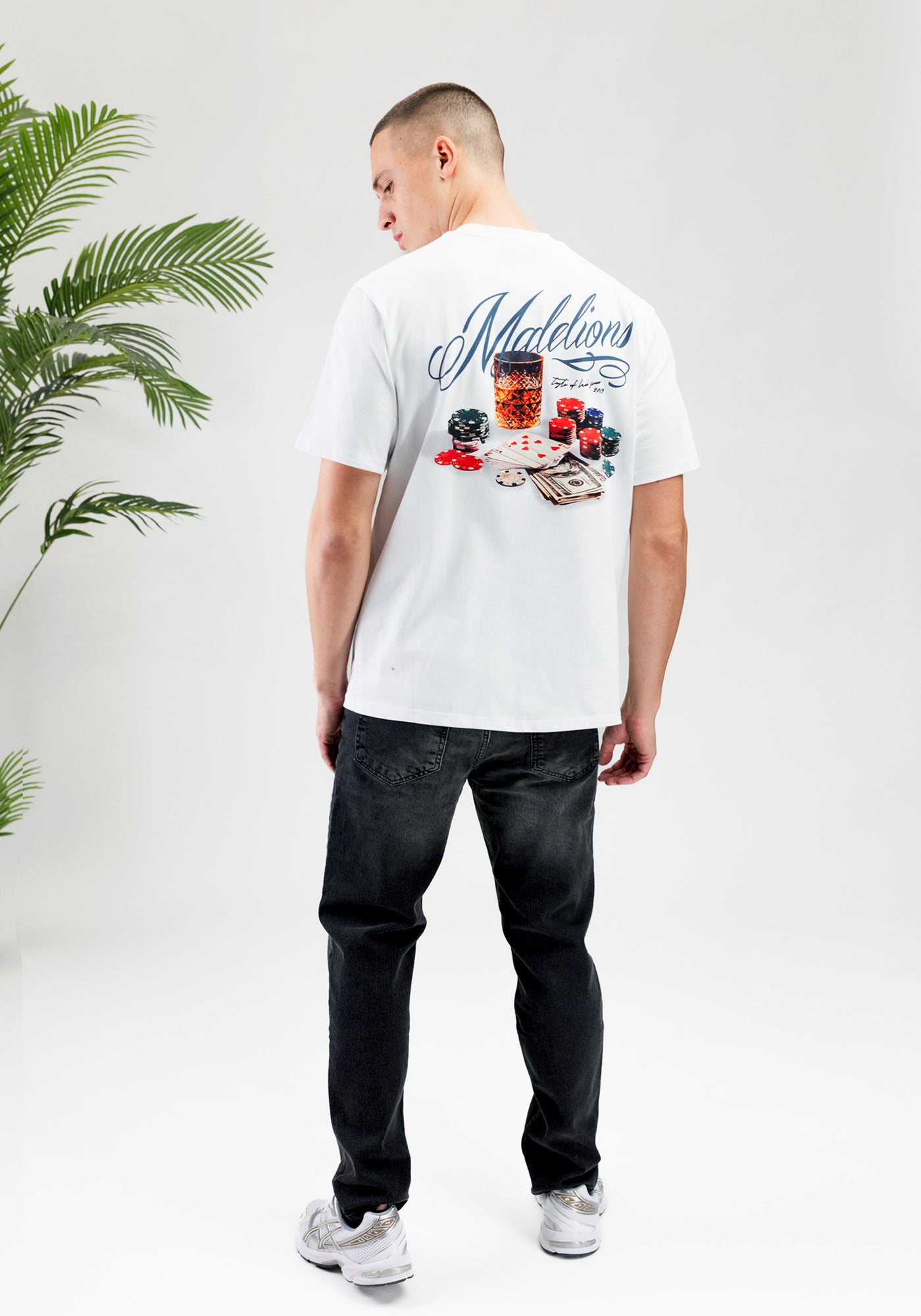 https://cdn.shopify.com/s/files/1/0935/6315/8909/files/MALELIONS_PLAYING_CARD_T-SHIRT--CD1052-WHITE-1.jpg?v=1771498024 Cotton District MALELIONS PLAYING CARD T-SHIRT WHITE
