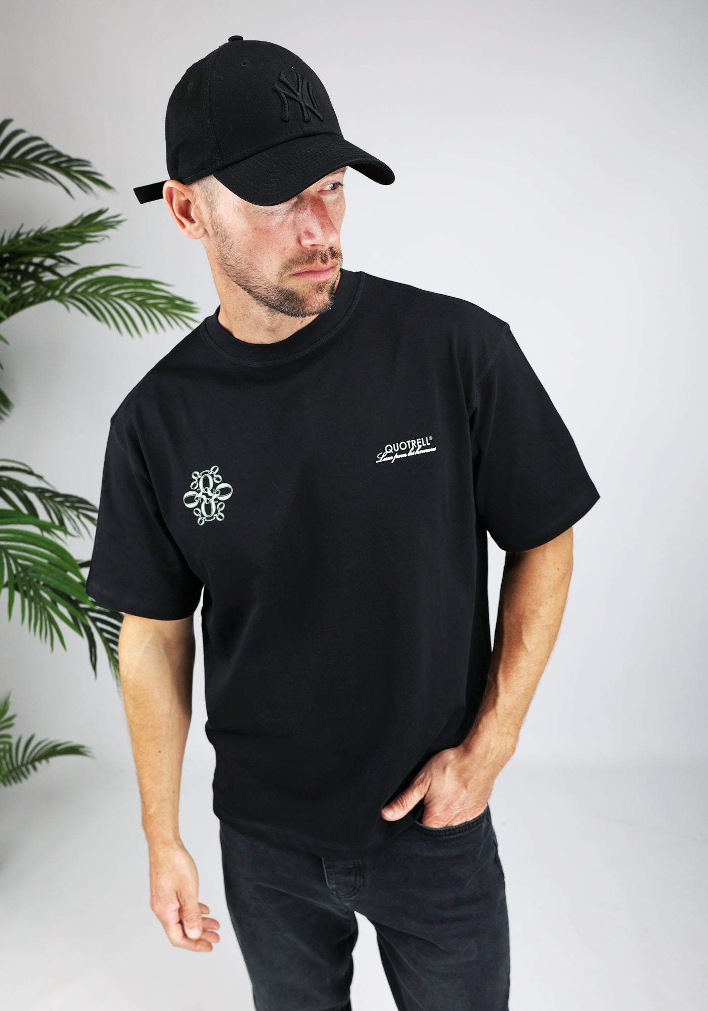 https://cdn.shopify.com/s/files/1/0935/6315/8909/files/QUOTRELL_INSIGNIA_T-SHIRT--CD1042-BLACK-1.jpg?v=1771494573 Cotton District QUOTRELL INSIGNIA T-SHIRT BLACK