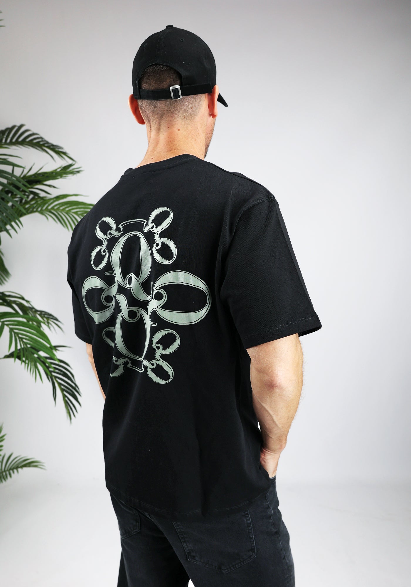 https://cdn.shopify.com/s/files/1/0935/6315/8909/files/QUOTRELL_INSIGNIA_T-SHIRT--CD1042-BLACK-2.jpg?v=1771494574 Cotton District QUOTRELL INSIGNIA T-SHIRT BLACK