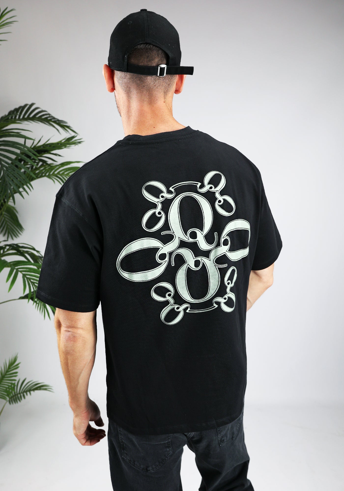 https://cdn.shopify.com/s/files/1/0935/6315/8909/files/QUOTRELL_INSIGNIA_T-SHIRT--CD1042-BLACK.jpg?v=1771494574 Cotton District QUOTRELL INSIGNIA T-SHIRT BLACK