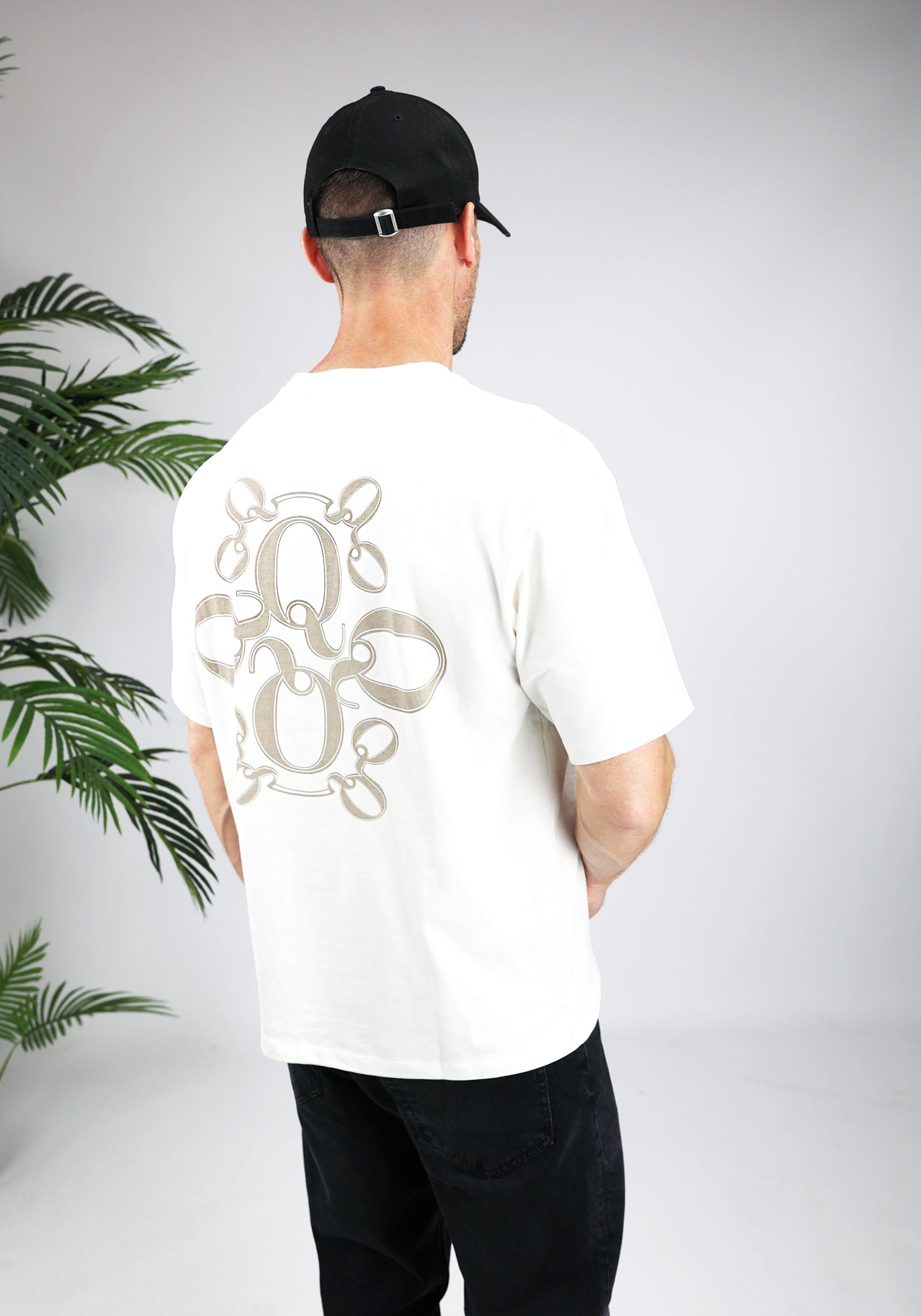 https://cdn.shopify.com/s/files/1/0935/6315/8909/files/QUOTRELL_INSIGNIA_T-SHIRT--CD1042-ECRU-2.jpg?v=1771494593 Cotton District QUOTRELL INSIGNIA T-SHIRT ECRU